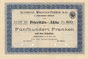 Altes deutsches Aktienzertifikat mit blauer Umrandung, Text lautet "Schweiz Wagons-Fabrik A.G."