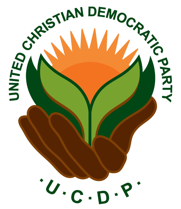 Logo der Vereinigte Christlich-Demokratische Partei (VCDP): eine Hand, die eine leuchtend gelbe Blume mit einem grünen Stiel und Blättern hält, mittig in einem blauen und gelben Kreis auf einem weißen Hintergrund, mit "VCDP" in fetter schwarzer Schrift darunter.