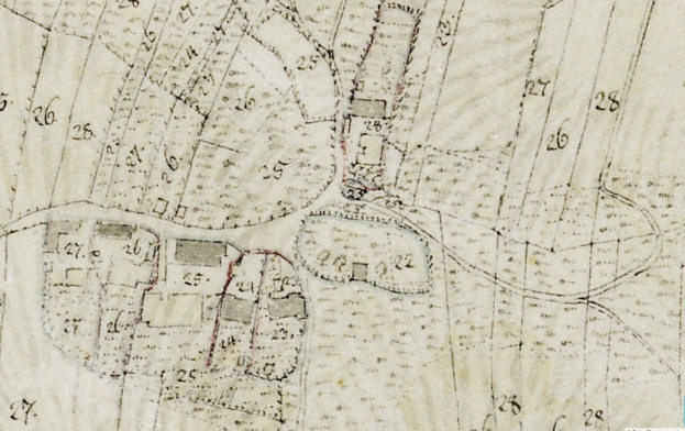 Ausführliche alte Stadtkarte, die Gebäude, Straßen und Text zeigt, mit einer vorgeschlagenen Entwicklungsnotiz unten.