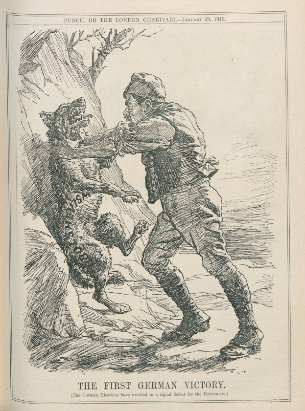 Offenes Buch mit einer Zeichnung eines Mannes mit Hut und einem Hund daneben, mit der Aufschrift 'Die erste deutsche Niederlage' auf der Seite.