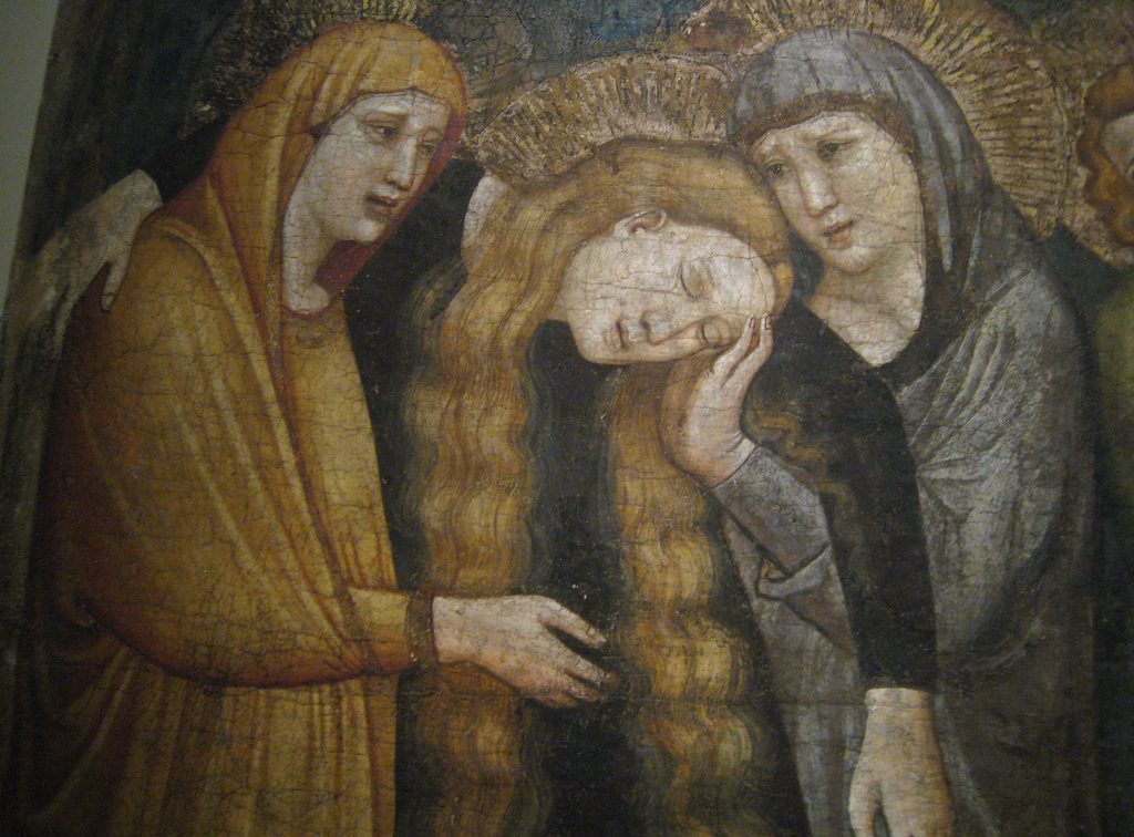 Ein abstraktes Gemälde mit leuchtenden Farben und geometrischen Formen.