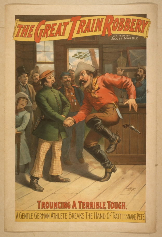 Plakat, das eine Gruppe von Menschen auf einem Boden mit einer Person zeigt, die eine Waffe hält, ein Fenster und eine Wand im Hintergrund und den Text "The Great Train Robbery - Trouching a Terrible Tough" oben und unten.